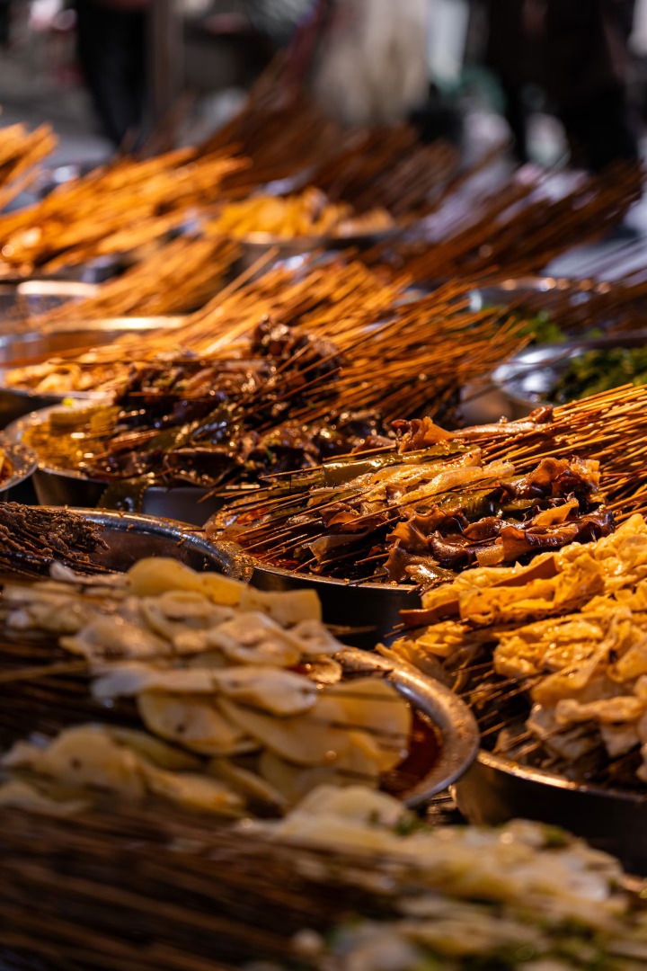 Sichuan street food dishes on a table